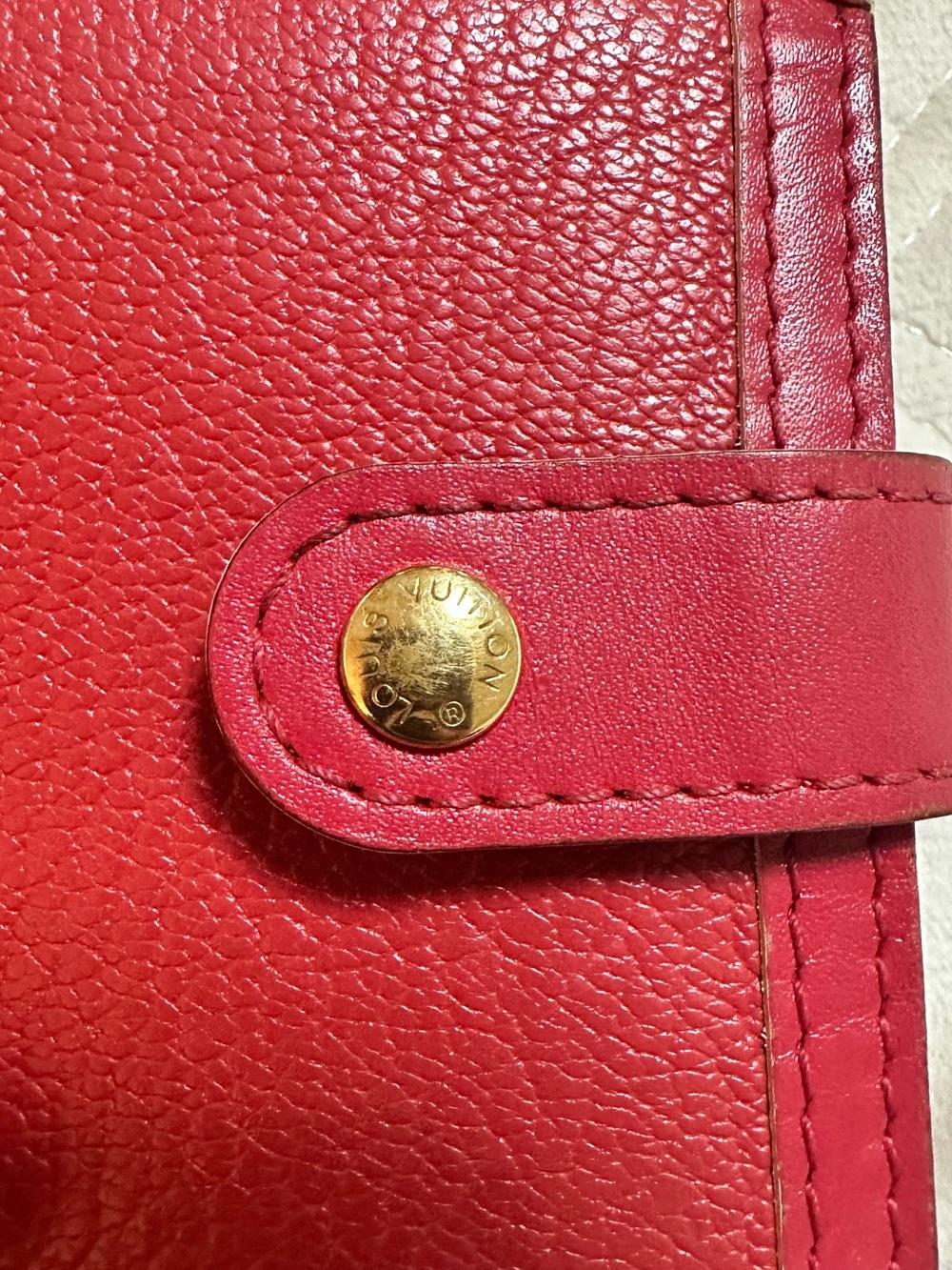 Authentic Louis Vuitton Red Pebbled Leather Snap Wallet with Gold-Tone Stud